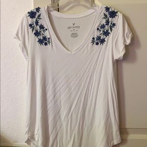white top with floral designs
